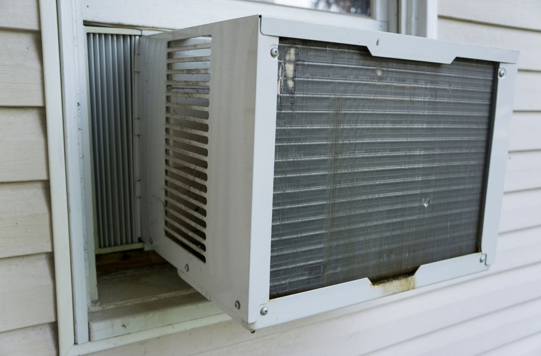 Should a Window Air Conditioner Be Tilted? 11 AC Queries