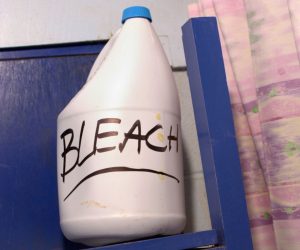 Bleach bottle and warning label illustrating the dangers of inhaling bleach fumes indoors