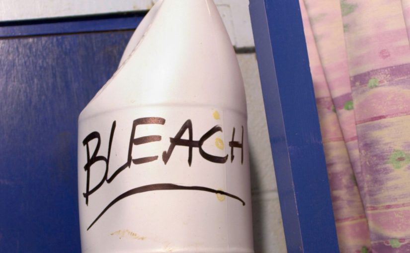 Bleach bottle and warning label illustrating the dangers of inhaling bleach fumes indoors