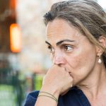 picture of a woman concerned about VOCs in her home.