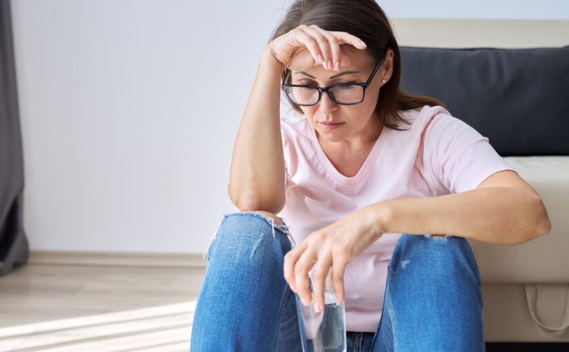 Frustrated woman waiting for CPAP repair after machine stopped working from using tap water instead of distilled