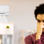 Do You Really Need a UV Light in Your HVAC System? Here’s How to Tell A woman contemplating buying a UV air purification system