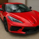 Does Ozone Work for Car Odors? red corvette with ozone generator running to remove odors